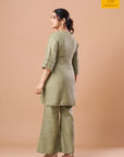 Olive mirror work kurta set styled for a festive occasion by Sandhya Shah