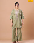 Hand mirror work embroidery on an olive kurta set bodice