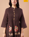 Floral cross stitch embroidery on a brown mul cotton kurta